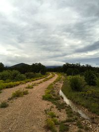 Dirt road passing through landscape