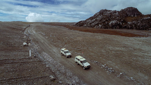 High angle view of cars on road against sky