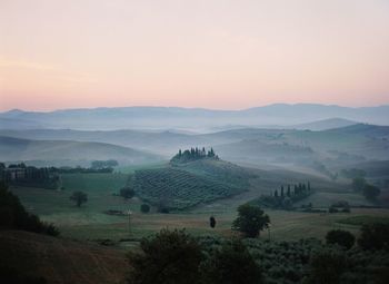 Scenic view of landscape against sky during sunset