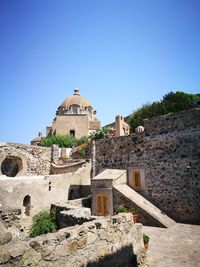 View of temple against clear blue sky