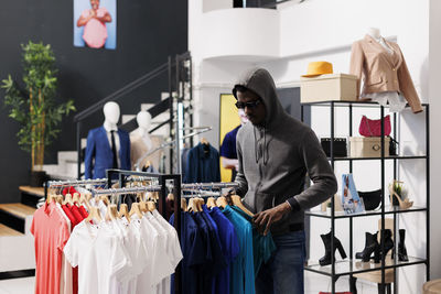 Rear view of woman standing in store