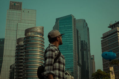 Low angle view of modern buildings against sky in city