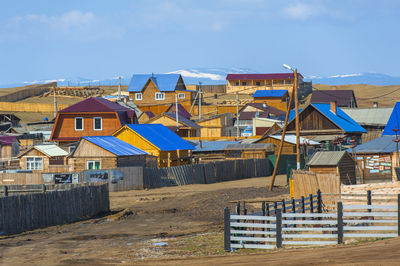 Houses and buildings against sky