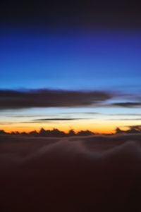 Scenic view of desert against sky during sunset