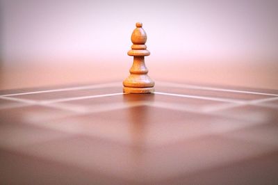 Close-up of bishop on table