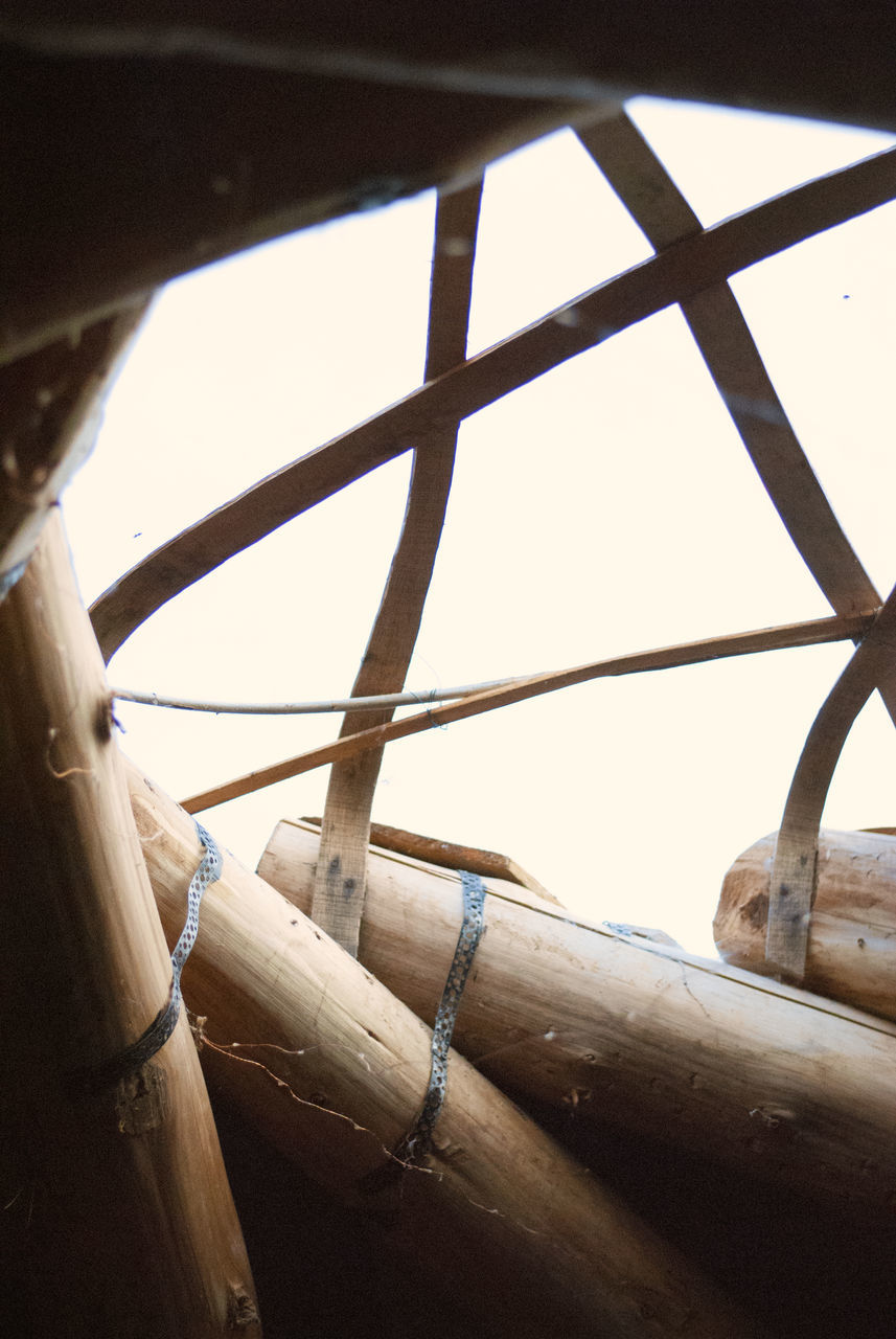 transportation, no people, wood - material, nautical vessel, mode of transportation, low angle view, rope, day, sky, nature, outdoors, close-up, water, focus on foreground, bamboo, wood, connection, clear sky