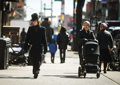 People walking on street in city