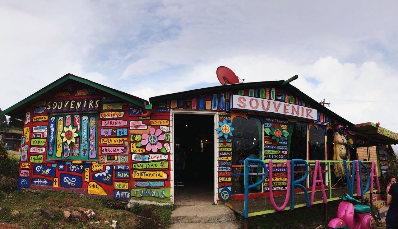 multi colored, sky, architecture, built structure, building exterior, cloud - sky, text, graffiti, communication, nature, western script, creativity, day, no people, outdoors, art and craft, building, shape, store, variation