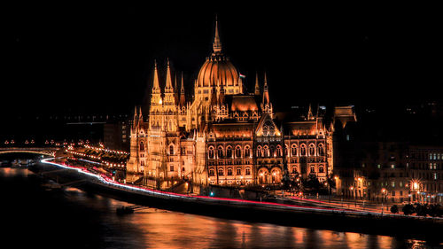 Illuminated cathedral in city at night