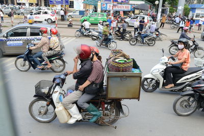 People riding bicycles on city street