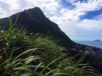 Scenic view of sea with mountains in background