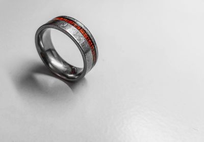 High angle view of ring on table against white background