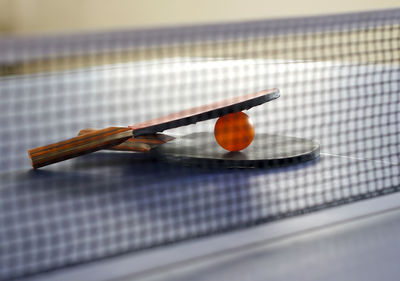 Close up of tennis rackets on table