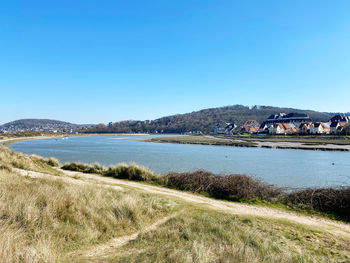 Scenic view of sea against clear blue sky