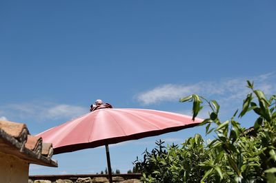 Low angle view of roof against clear blue sky