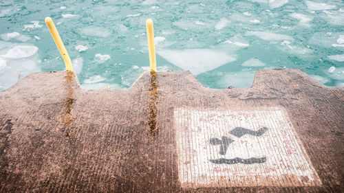 High angle view of text on snow