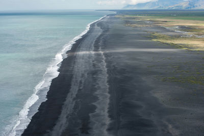 Aerial view of beach against sky