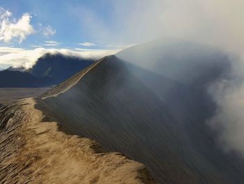 Panoramic view of volcanic landscape against sky