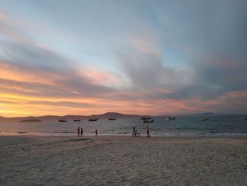 Scenic view of beach against sky during sunset