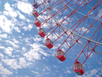 Low angle view of ferris wheel against sky