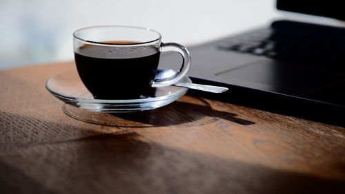 Close-up of coffee cup on table