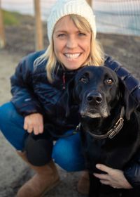 Portrait of smiling woman with dog