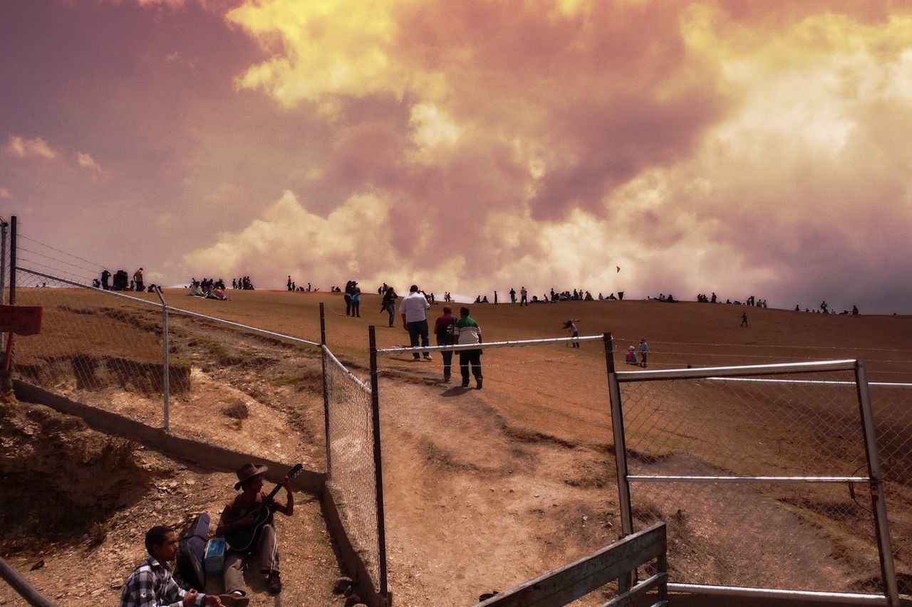 PEOPLE IN CLOUDY SKY