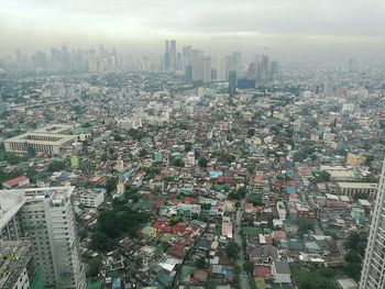 Aerial view of cityscape against sky