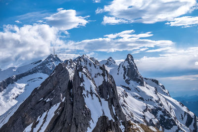 Panoramic view of snowcapped mountains against sky