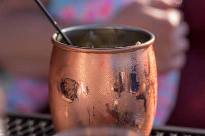 Closeup of a moscow mule mixed drink in a copper mug