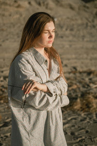 Young woman standing outdoors