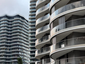 Low angle view of modern buildings against sky