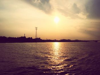 Scenic view of sea at sunset