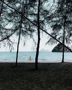 Man looking at sea against sky