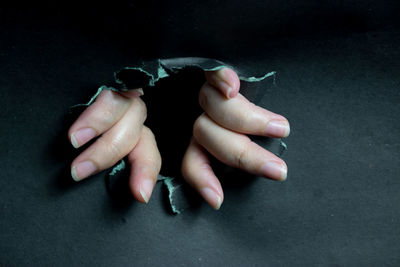Cropped hand of woman with nail polish