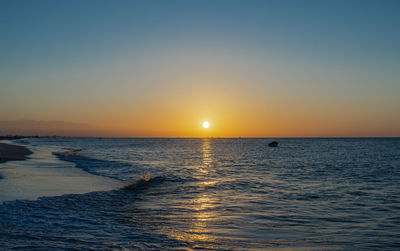 Scenic view of sea against sky during sunset