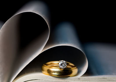 Close-up of diamond ring in pages