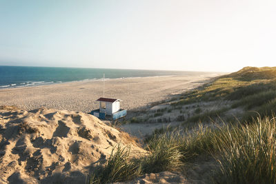 Scenic view of beach against clear sky