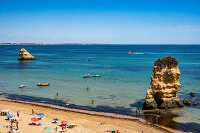 Scenic view of sea against clear blue sky