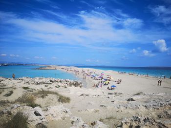 Scenic view of beach against blue sky