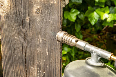 Close-up of rusty metallic structure in yard