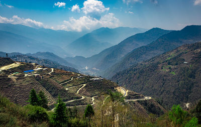 Mountain valley with mountain curvy road and bright blue sky at morning form flat angle