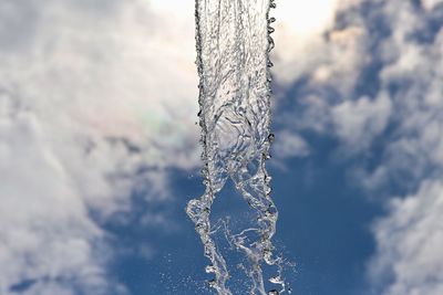 Close-up of frozen tree against sky