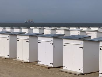 View of sea and buildings against sky