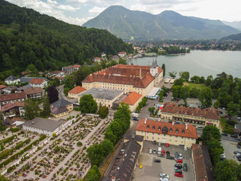 High angle view of townscape by mountains