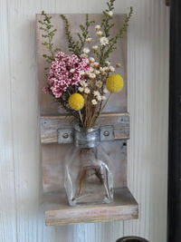 Close-up of flower vase on wooden table