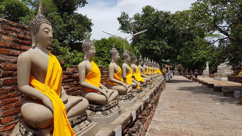 Panoramic view of buddha statue against trees