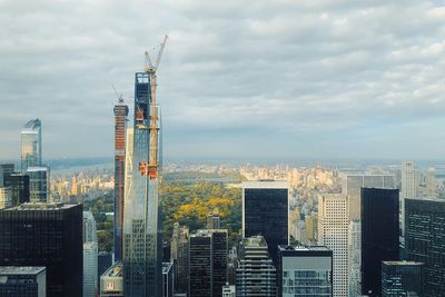 Modern buildings in city against sky