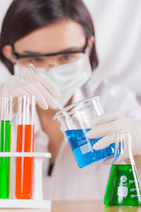 Female scientist holding medical sample at laboratory