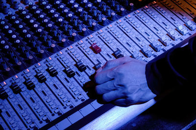 Cropped image of man using sound mixer